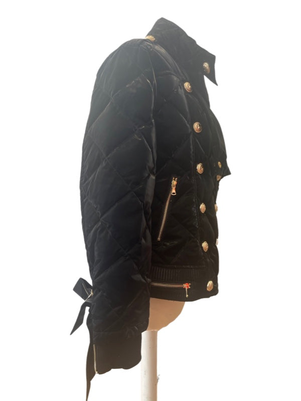 Side view black quilted jacket with gold lion buttons