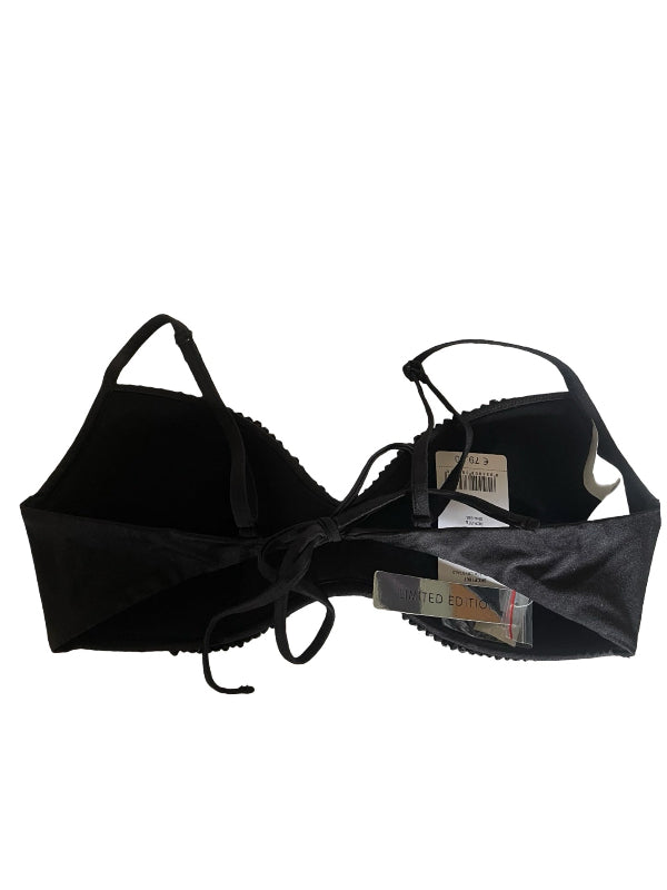 Black strappy bikini top with molded cups and a front tie closure, shown flat against a white background with retail tags attached.