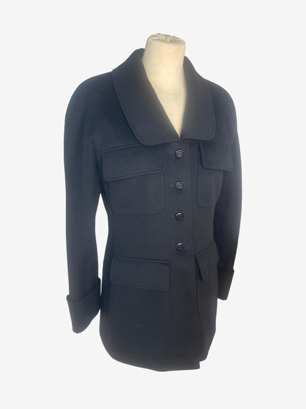 A black wool-blend coat with a wide collar and front button closure, displayed on a mannequin torso against a plain white background.