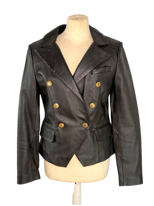 A black leather double-breasted blazer jacket with gold buttons, displayed on a beige mannequin torso against a white background.