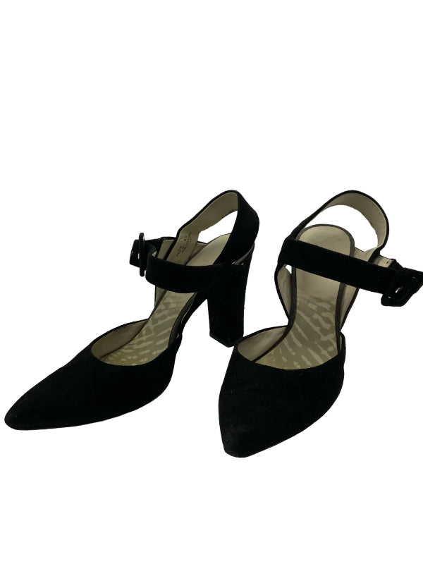 A pair of black pointed-toe mary jane heels with ankle straps and block heels, shown on a plain white background.