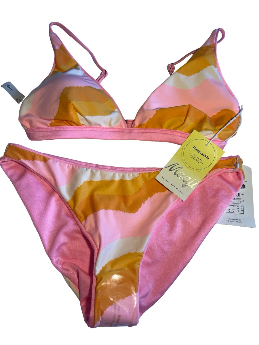 A two-piece bikini set with a pink, orange, and white abstract wavy pattern, shown with its yellow and white retail tags against a white background.