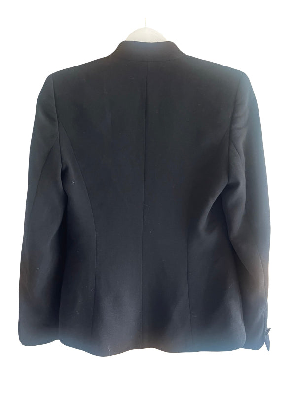 A black tailored blazer jacket displayed on a white hanger against a plain white background, showing the back view.