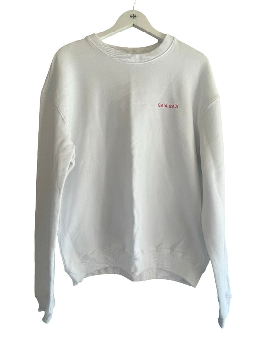 A white crewneck sweatshirt with 'GALA GALA' embroidered in pink on the left chest, hanging on a white wooden hanger against a white background.