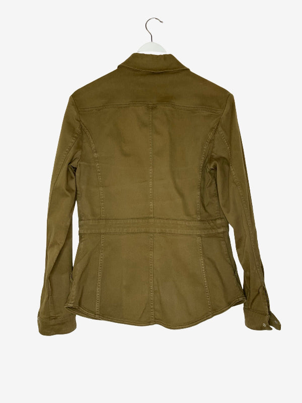 An olive green utility jacket shown from the back, hanging on a white hanger against a light gray background.