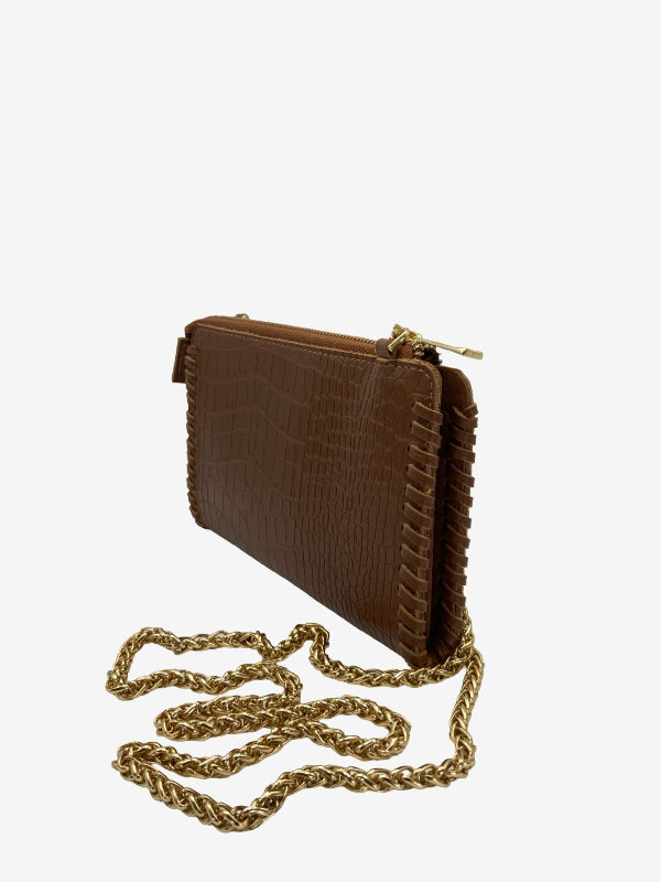 A brown crocodile-embossed leather clutch bag with a gold-tone chain strap, displayed on a clean white background.