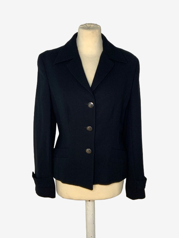 A black tailored blazer jacket displayed on a cream-colored mannequin torso against a plain white background.