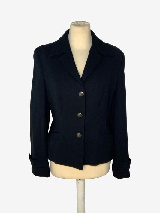 A black tailored blazer jacket displayed on a cream-colored mannequin torso against a plain white background.