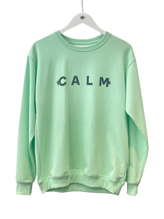 Pale green sweatshirt with Calm in dark blue black writing 