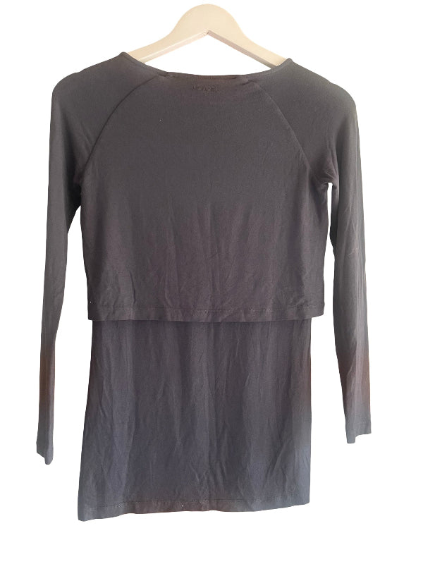 A dark blue gray long-sleeve top with a layered, asymmetrical hem design, hanging on a light wooden hanger against a plain white background.
