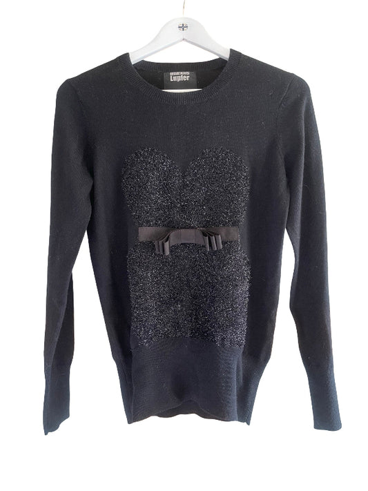 A black knit sweater with a textured, sparkly black corset-style panel on the front, a matching black belt detail, and a white hanger, shown against a plain white background.
