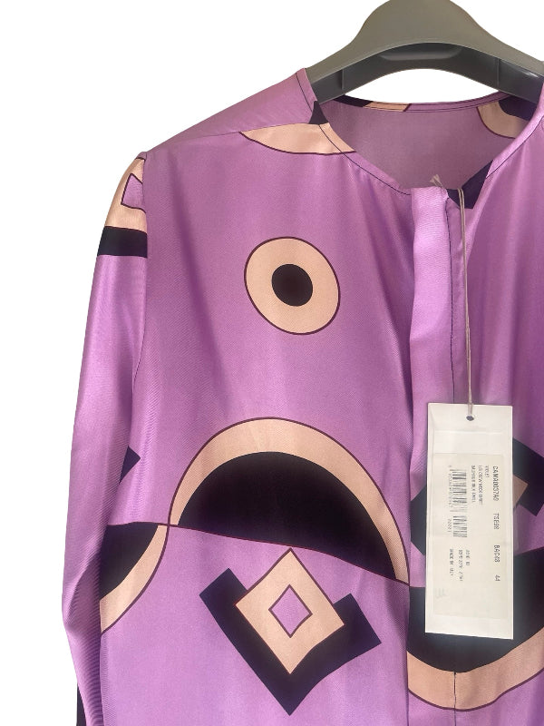 A purple long-sleeve blouse with a bold abstract graphic print in beige, black, and purple, hanging on a black hanger with a white product tag.