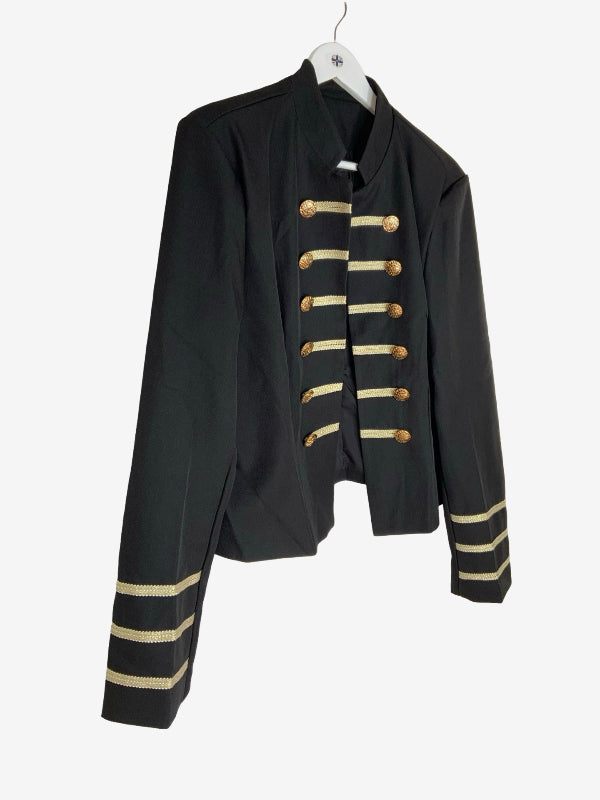 A black military-style jacket with gold buttons and gold stripes on the cuffs, hanging on a white hanger against a light gray background.