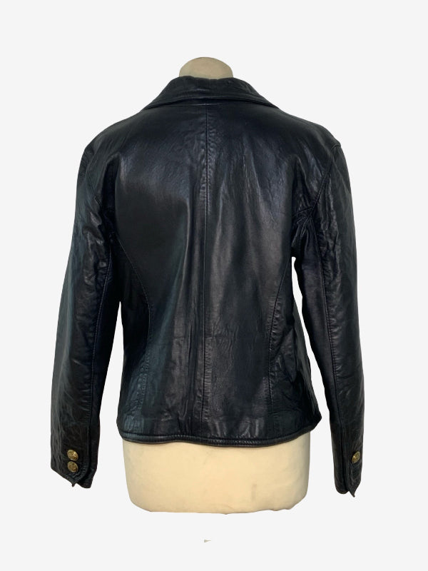 A black leather jacket shown from the back on a cream-colored mannequin torso against a plain white background.