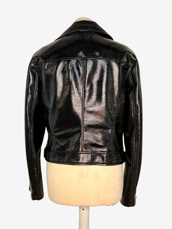 A black glossy faux-leather jacket displayed on a cream-colored mannequin torso, showing the back view against a plain white background.