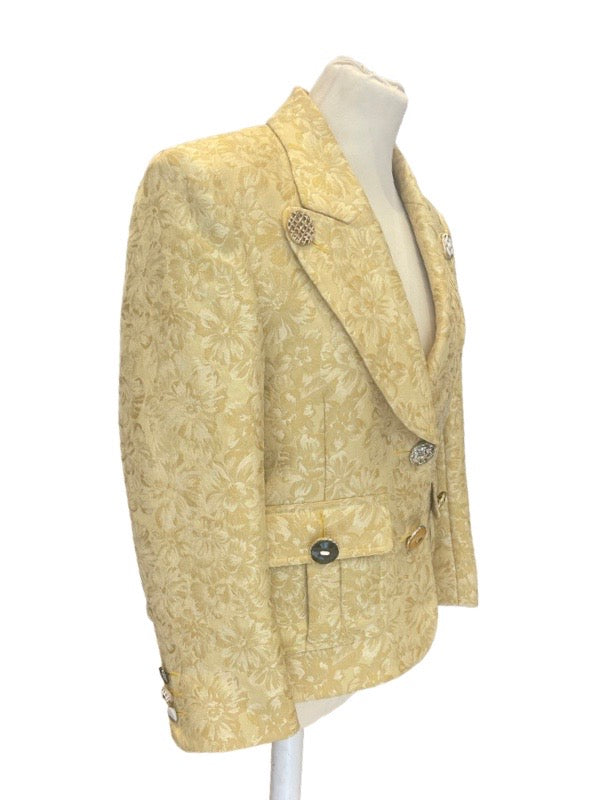 Gold damask jacket on mannequin with different custom buttons