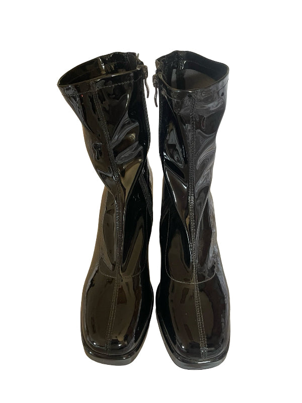 A pair of glossy black patent leather ankle boots with side zippers, shown against a plain white background.