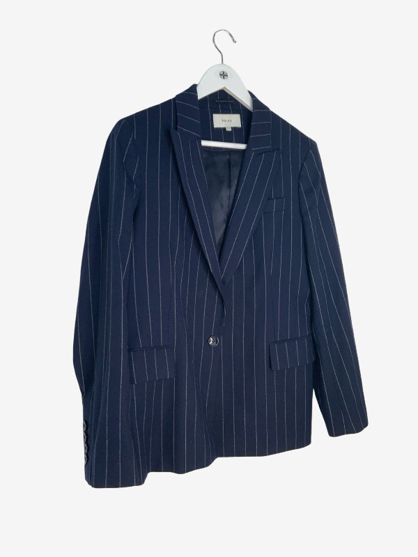 A navy blue pinstripe blazer jacket hanging on a white hanger against a plain white background.
