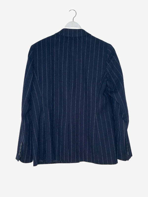 A navy blue pinstripe blazer jacket hanging on a white hanger against a light gray background.