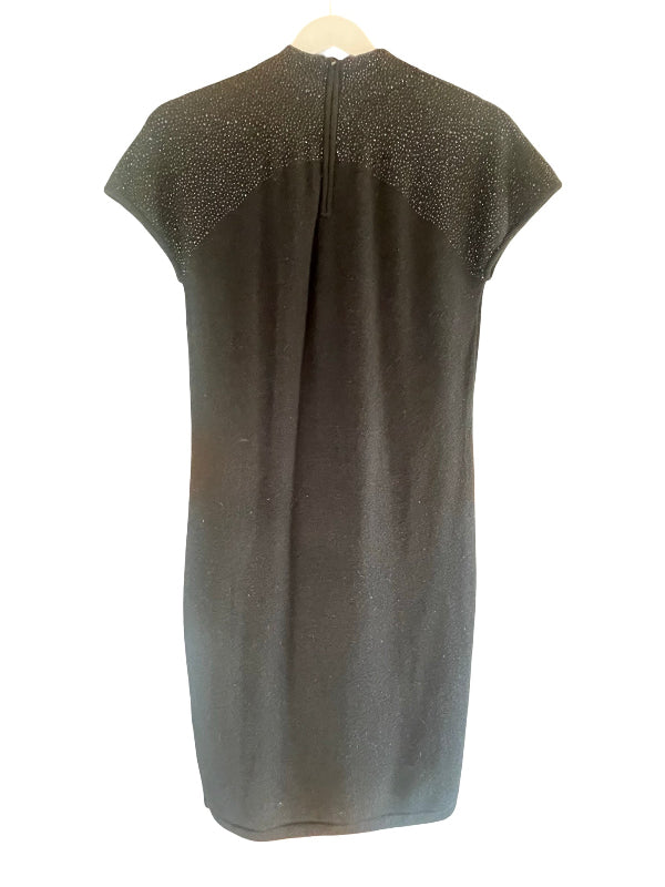 A black short-sleeve dress with a textured, sparkly embellished yoke across the shoulders, shown from the back on a hanger against a white background.