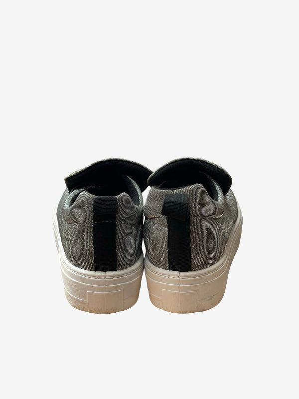 A pair of low-top slip-on sneakers shown from the back, featuring a textured gray fabric upper, a black heel tab, and thick off-white platform soles, set against a plain light gray background.