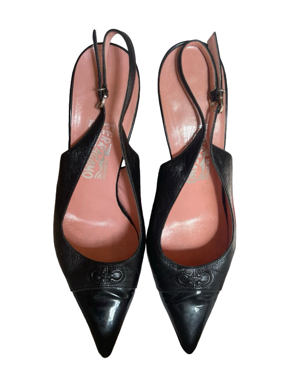 A pair of black leather slingback pointed-toe pumps with a glossy finish and embossed detailing on the toe, shown against a plain white background.