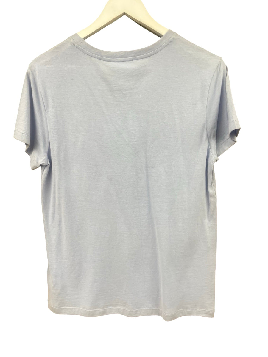 A light gray blue short-sleeve crewneck t-shirt hanging on a light wood hanger against a white background.