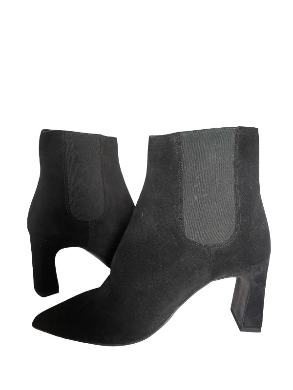 A pair of black suede ankle boots with block heels and elastic side panels, shown from a side profile view on a white background.