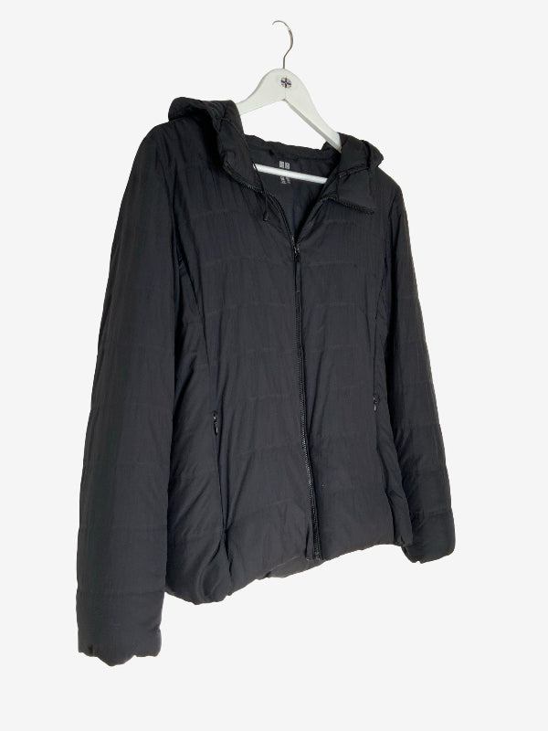 A black hooded puffer jacket hanging on a white plastic hanger against a plain white background.
