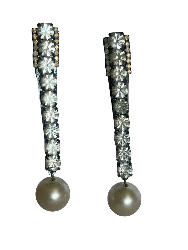 A pair of long drop earrings featuring a vertical row of clear faceted rhinestones in a silver-toned setting, with a round pearl-like gray bead hanging from the bottom, shown against a plain white background.