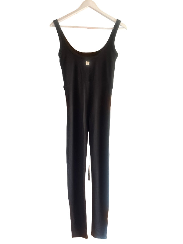A black sleeveless jumpsuit hanging on a white wooden hanger against a plain white background.