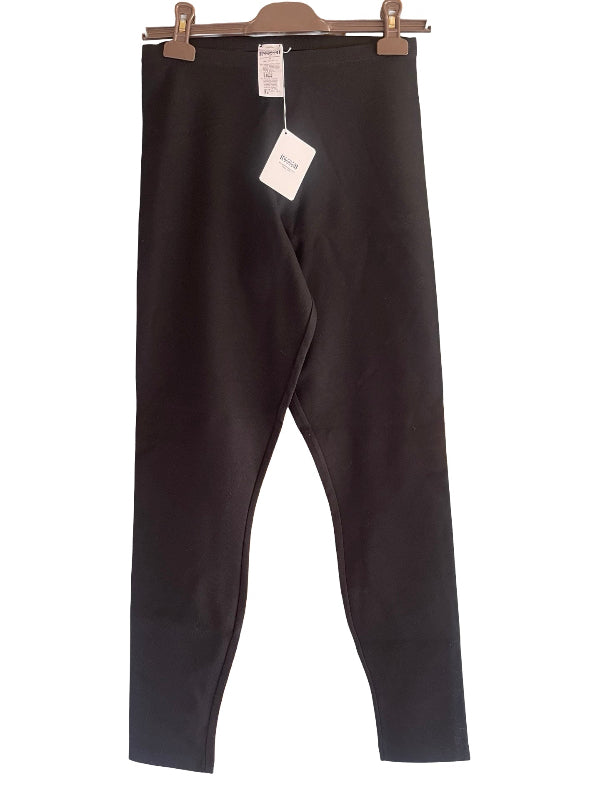 Black full-length leggings hanging from a wooden hanger with two metal clips against a plain white background. A white retail tag is attached near the waistband.