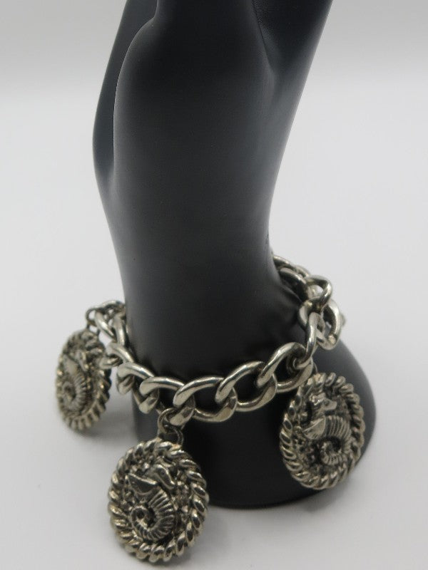 Silver heavy bracelet with 3 seahorse charms